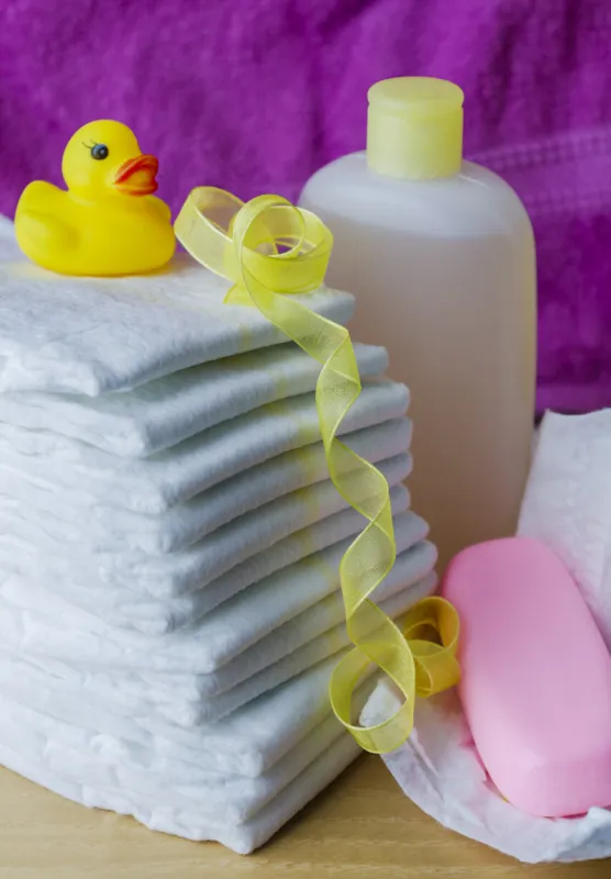 accessories for baby diapers on white background, banny, a bottle of water, cream