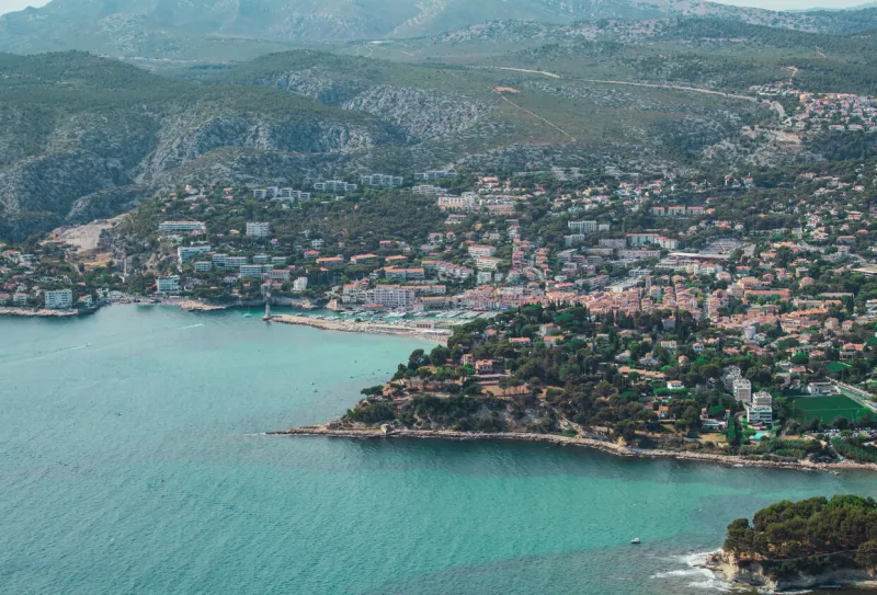 aerial view of the french riviera with turquoise water drone view of the city of cassis with turquoise sea