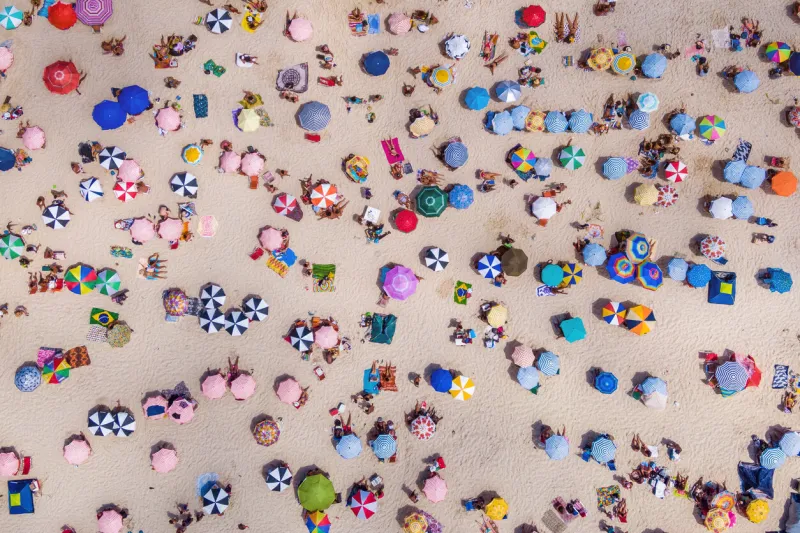 rio de janeiro, brazil, aerial top view of copacabana beach showing colourful umbrellas and people relaxing on a summer day tropical travel and vacation concept