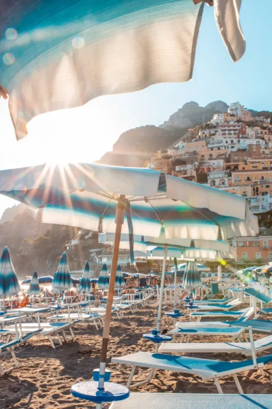 sunflare over positano beach umbrella