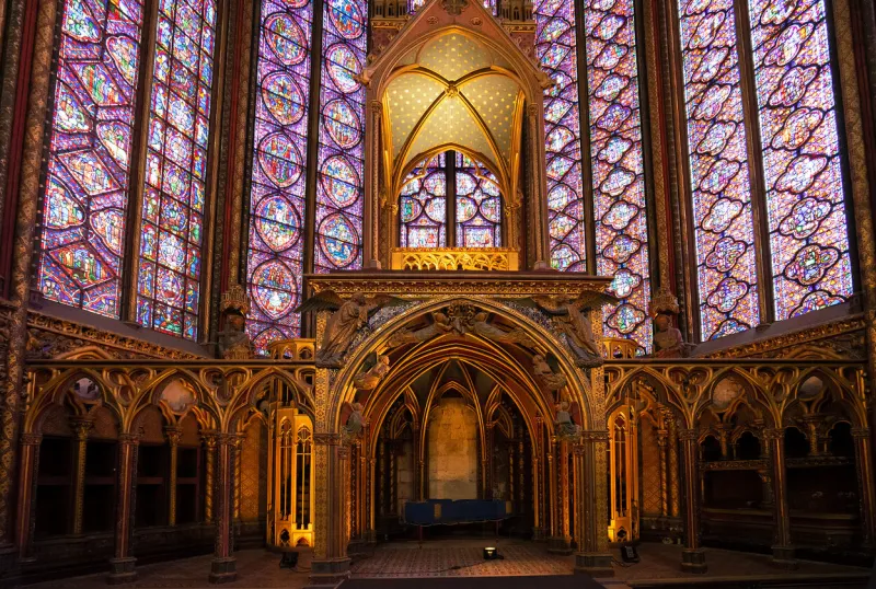 stained glass windows of saint chapelle with rose window, medieval church of 13c, paris france