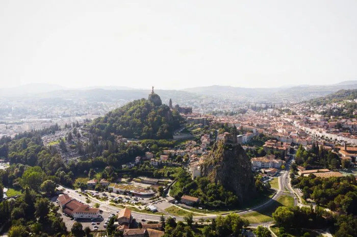 aerial panorama of historic architecture french town le puy-en-velay church on hill haute loire auvergne rhone alpes france europe