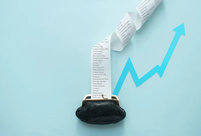 large receipt coming out of purse, inflation, food rising costs rising arrow