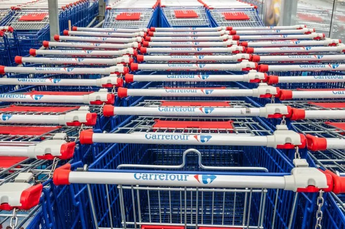 bucharest, romania 05012021  shopping carts belonging to carrefour hypermarket logo of the french retailer carrefour