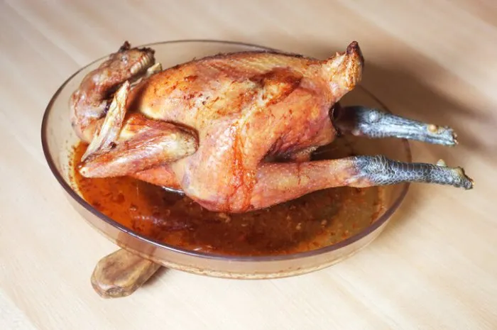 bresse chicken, speciality of bresse region, france, baked in the oven