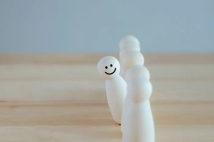 individuality unique happy and enjoy stand out from group smiling figure among many crowd human development psychology personality concept