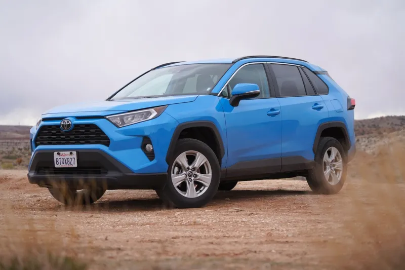 blue toyota rav4 parked on a dirt road in the utah wilderness with overcast sky off road driving bright blue toyota photo taken near kanab, utah