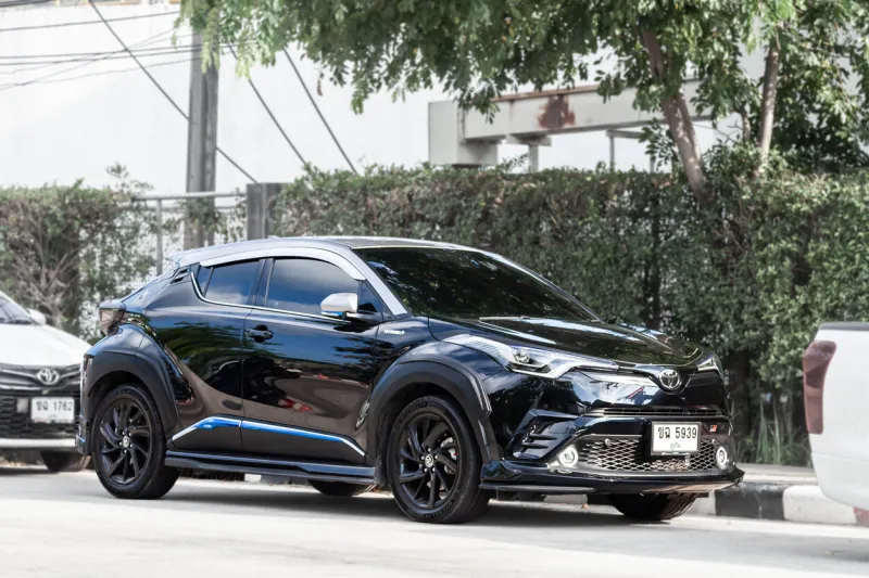 thailand, phuket - 033123  black toyota c-hr on the road in the city with traffic