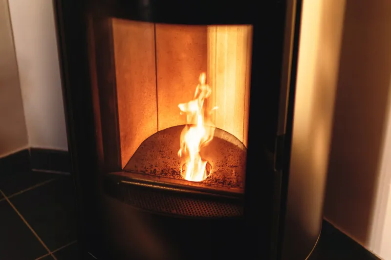 hearth of a pellet stove, granules stove with flames
