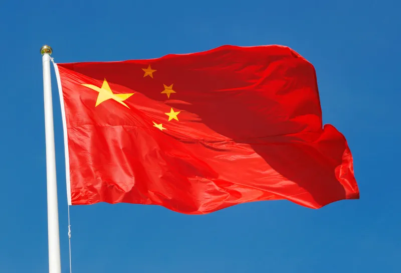 the national flag of the people's republic of china on blue sky