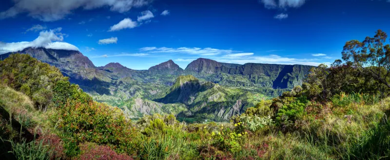 panoramic landscape of cirque de salazie caldera on reunion island with blue sky and cloudscape background