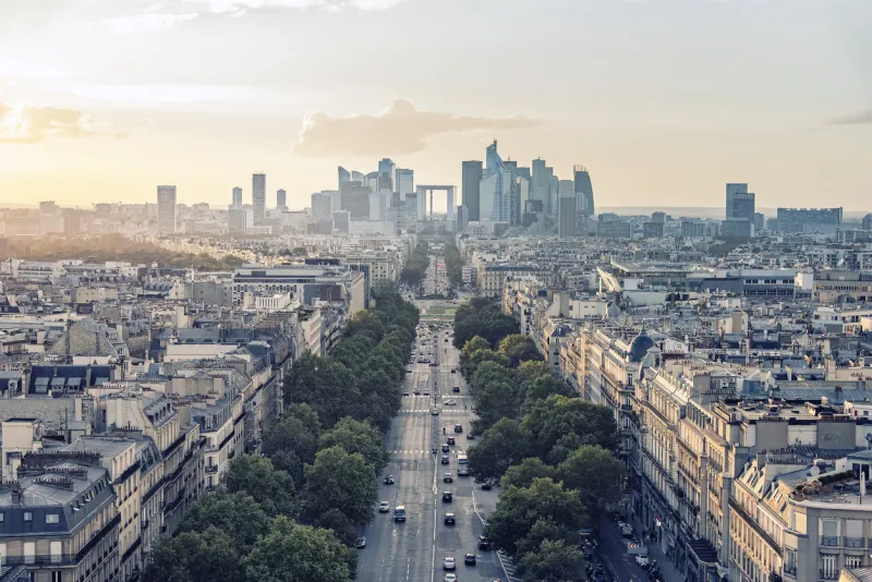 sunset over champs-elysees and la defense in paris