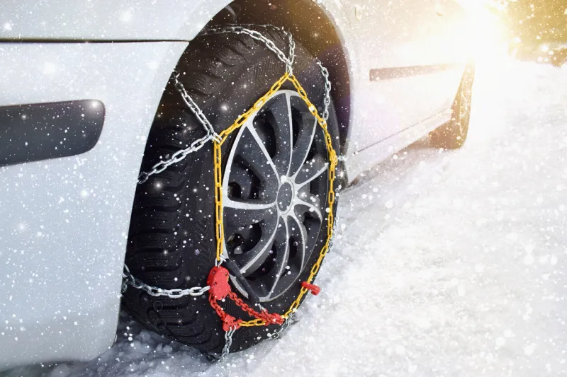 car with tyre chains in winter