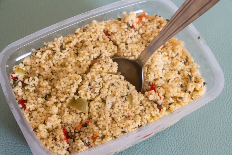 industrial tabbouleh in a plastic box with a spoon
