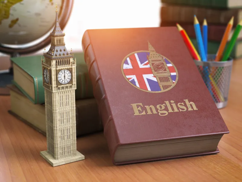 studying and learn english concept book with flag of great britain and big ben tower on the table 3d iluustration