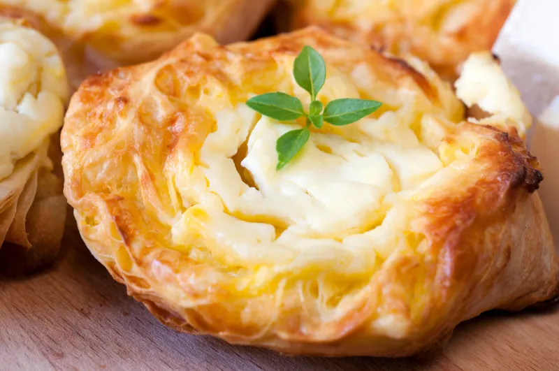 tasty baked pastry with melted feta cheese
