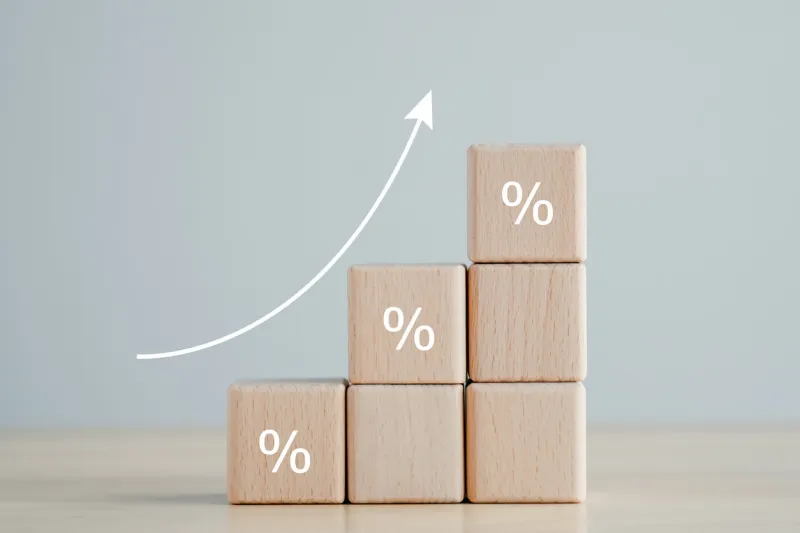 interest rate finance and mortgage rates concept wooden blocks with percentage sign and rise of arrow up, financial growth, interest rate increase, inflation, sale price and tax rise concept