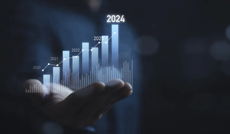 businessman holding glowing virtual technical graph and chart for analysis stock market in 2024, technology investment and value investment concept