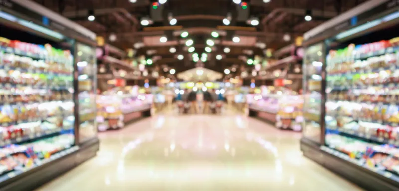 supermarket grocery store aisle and shelves blurred background