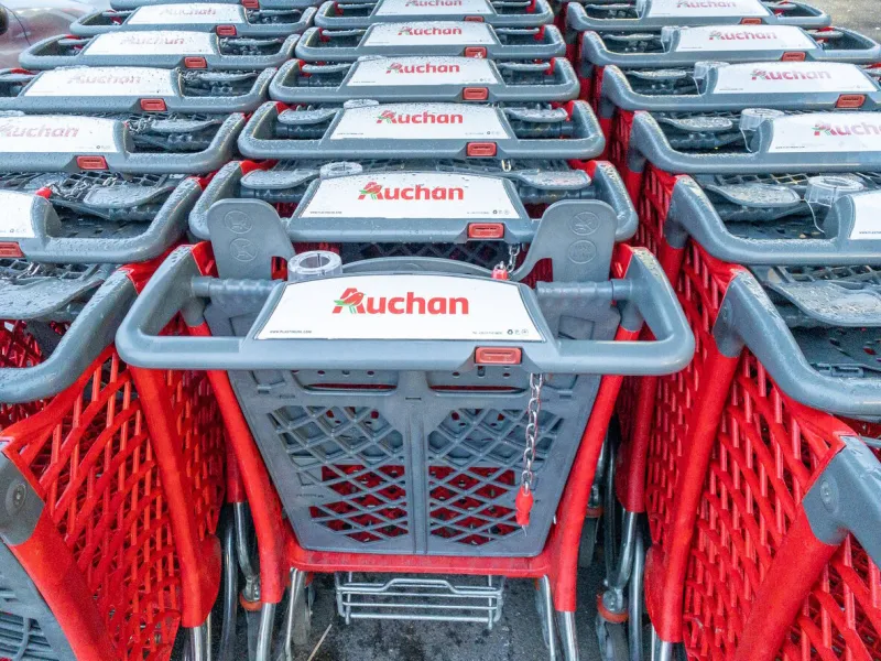 calais, france - january 14, 2020   close-up shopping trolleys auchan hypermarketauchan is a french international supermarket chain, is one of the largest distribution groups in the world