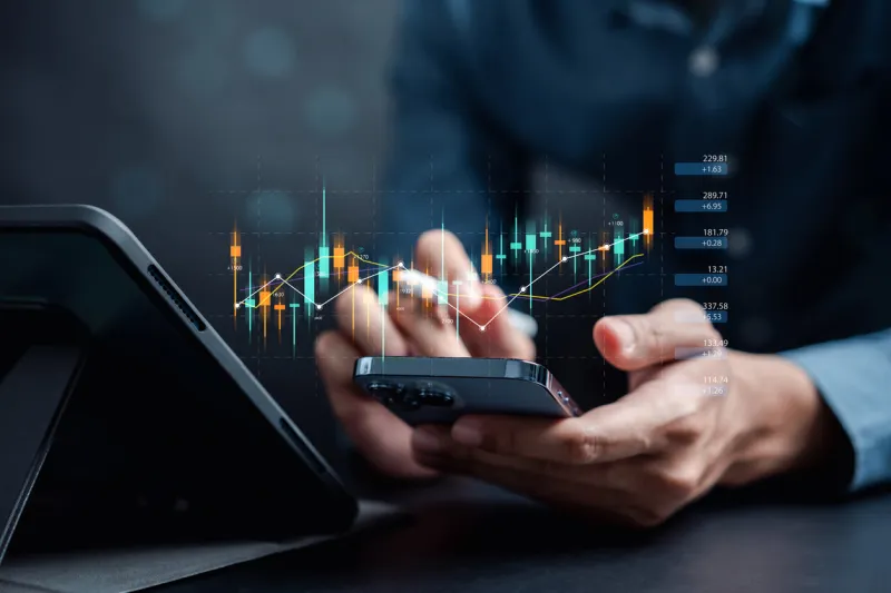 businessmen investor think before buying stock market investment using smartphone to analyze trading data investor analysis with stock exchange graph on screen financial stock market