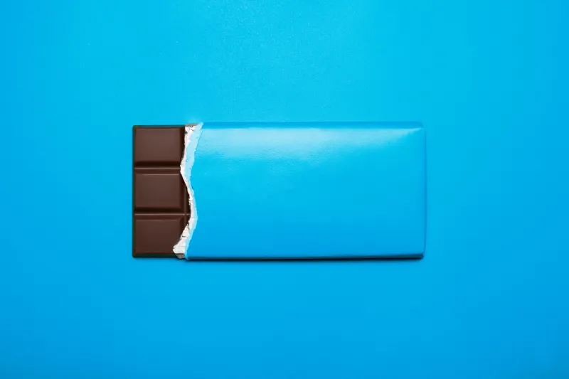 bar of chocolate on a blue background