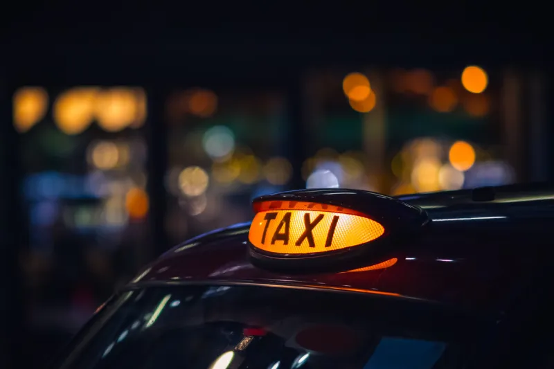 london black cab taxi sign at night