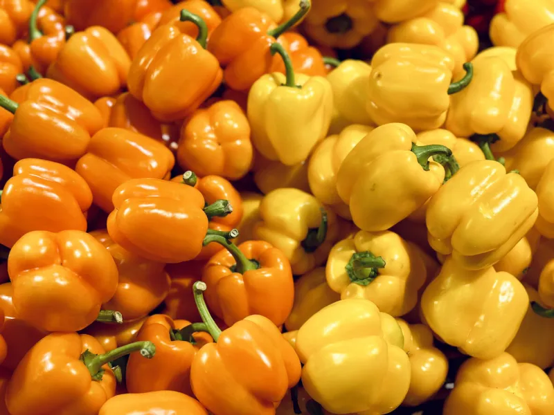 orange pepper and yellow pepper in the market