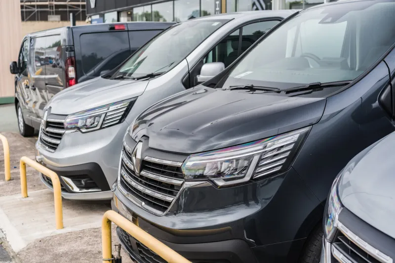 hanley, stoke on trent, enlgand, june 23rd 2023 a row of renault vans in a showroom forecourt, transport and commerce editorial illustration