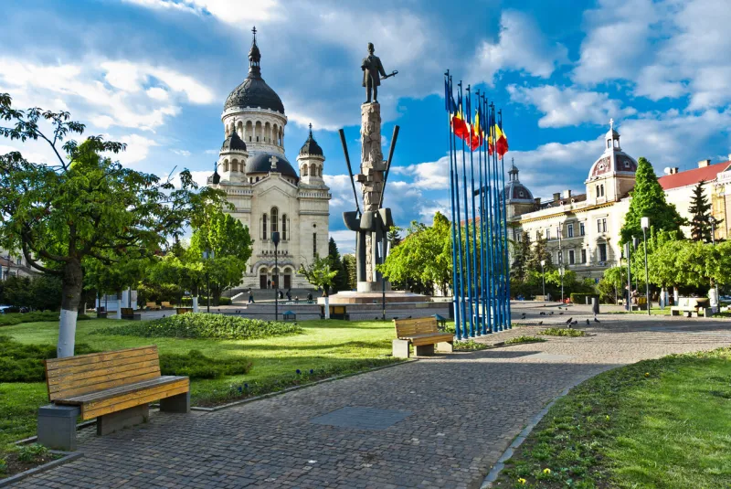 avram iancu square,cluj-napoca,romania with the statue of avram iancu(the leader of romanian revolution from transylvania 1848-1849) and the orthodox cathedral of cluj, alba,crisana and maramures