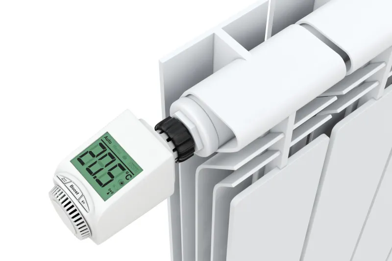 digital wireless radiator thermostatic valve connected to radiator on a white background 3d rendering