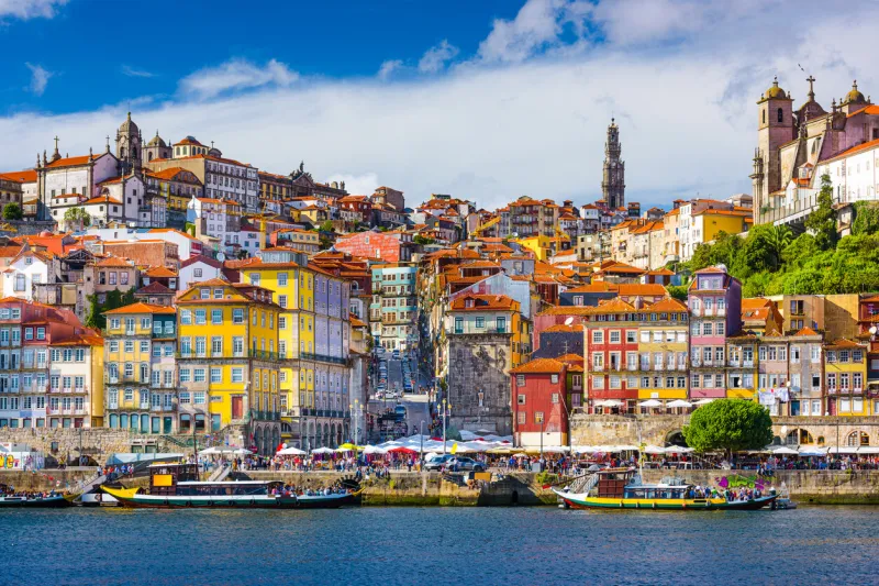porto, portugal old town skyline from across the douro river