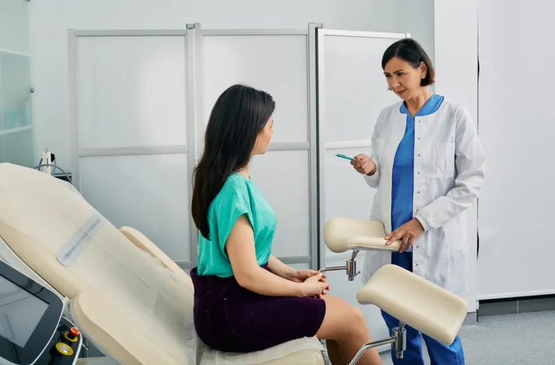 women's health, gynecology young woman during appointment with her gynecologist at gynecology clinic