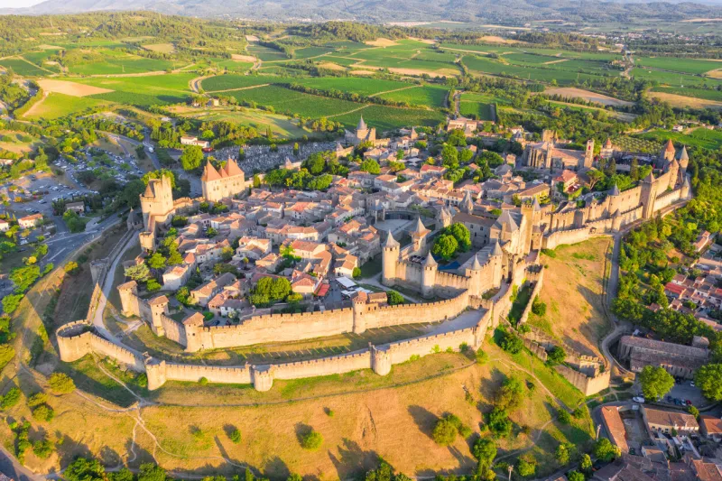 medieval castle town of carcassone at sunset, france