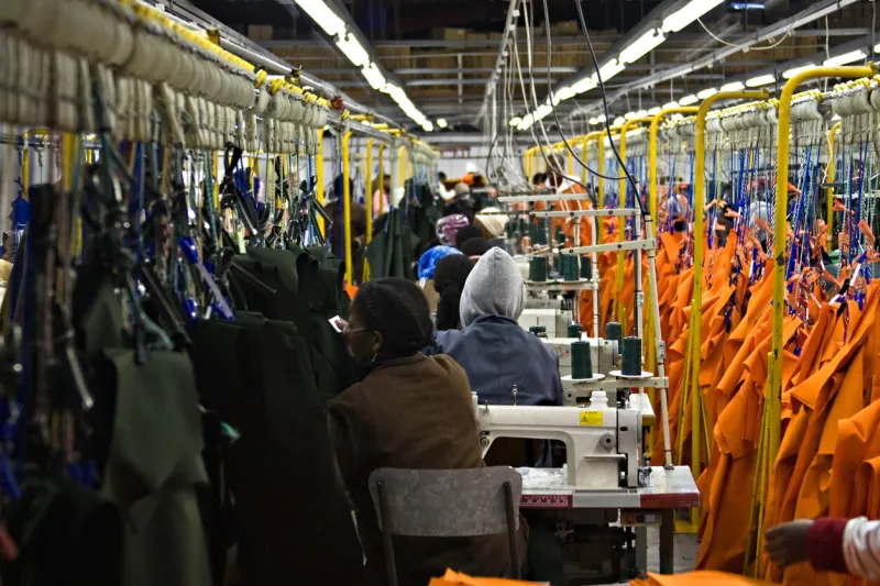 african american woman working in a clothing factory, industrial series