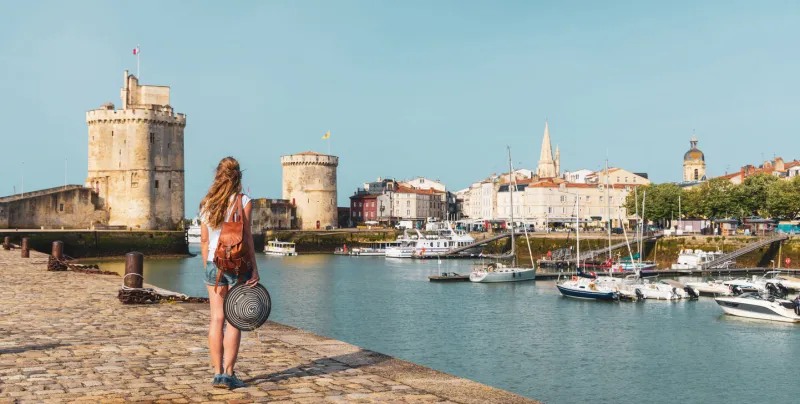 woman traveling in france, la rochelle, south west france, nouvelle aquitaine