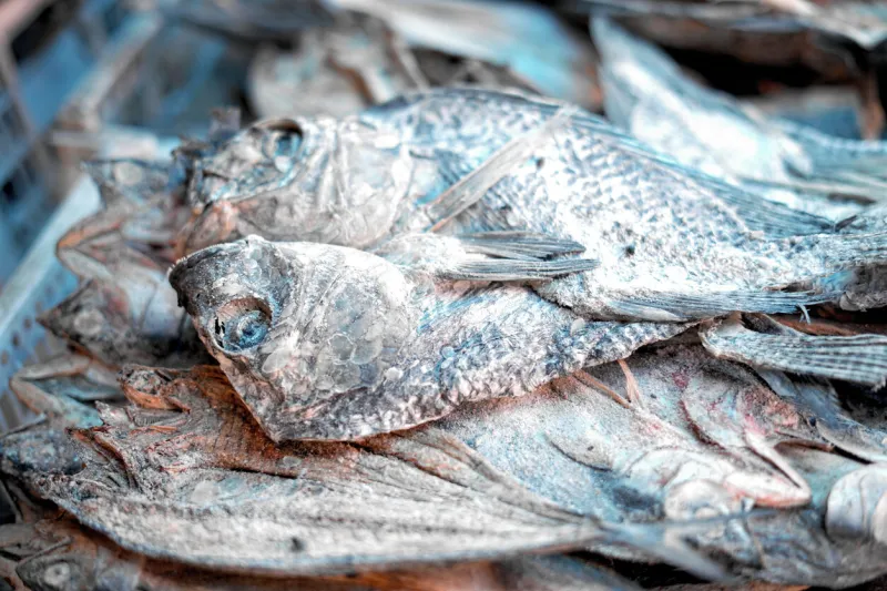 pile of dried salty fish for sale at traditional fish market
