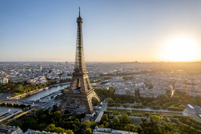 aerial view of paris, france, overlooking the famous eiffel tower, sunrise in the background