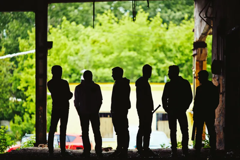 outlines of dangerous guys outside