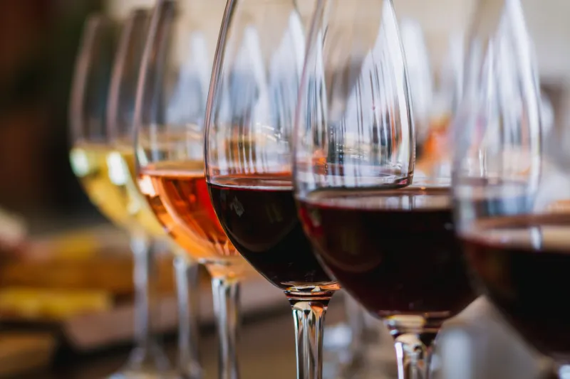 selective focus on a selection of red, rose and white wines during a wine tasting event on the island of crete in greece