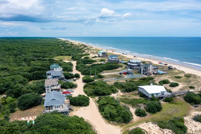 aerial view of beach homes in carova north carolina looking north towards false cape state park in virginia beach