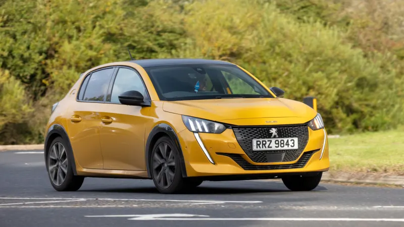 stony stratford, bucks, uk october 16th 2021 2020 yellow peugeot 208 driving on a country road