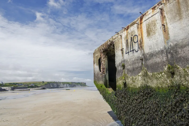 the remains of the normandy landings, a memorial monument in one of the beautiful beaches of the bay of arromanches where one of the bloodiest battles in history took place, better known as the landing of the americans, the famous d-day