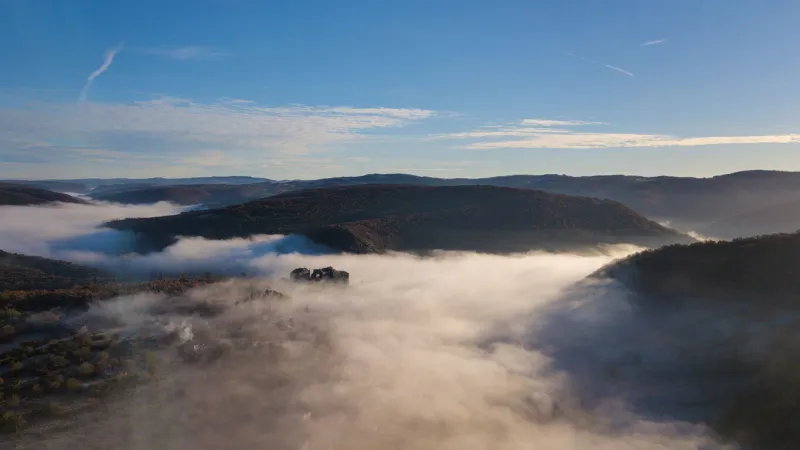 charming view of the bruniquel castle in the morning sun and clouds, france