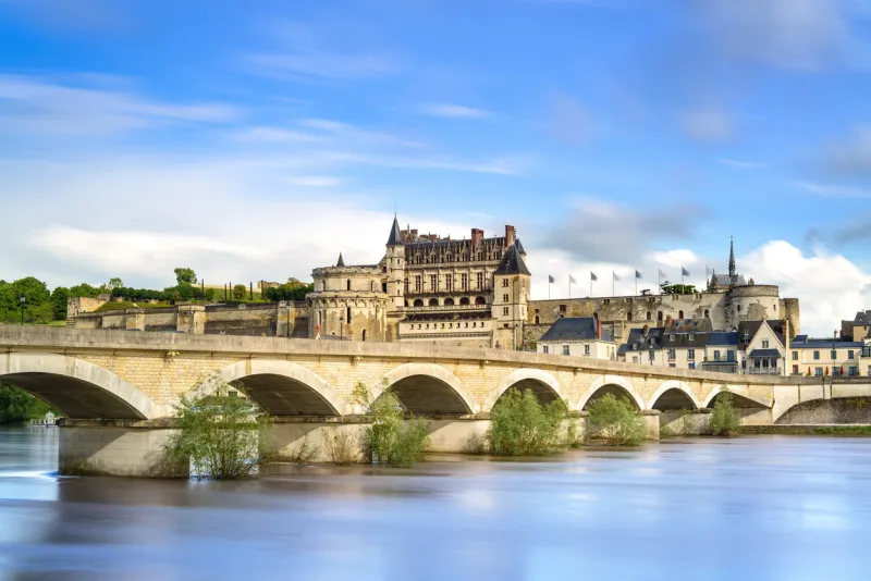 amboise medieval castle or chateau and bridge on loire river france, europe unesco site