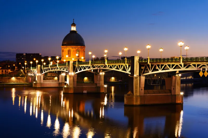 bridge and architecture of toulouse city in france at sunset