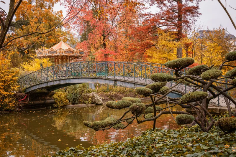iron footbridge of the jardin public park in autumn in bordeaux, france