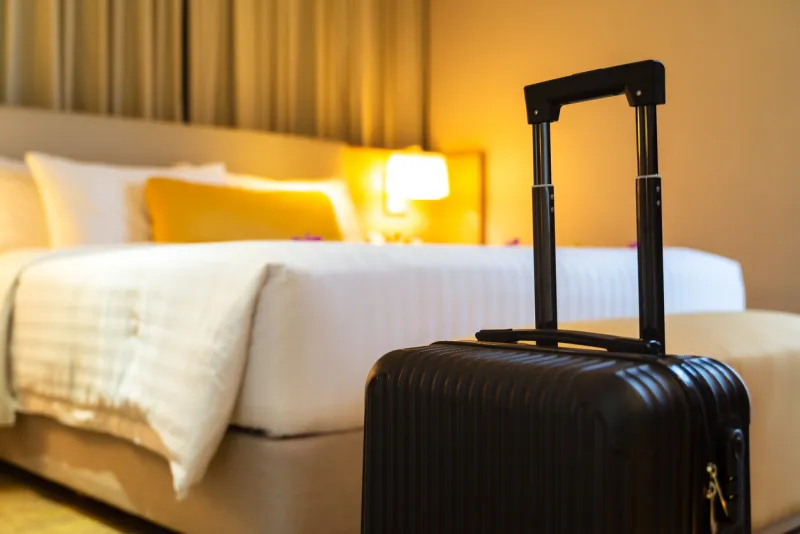 suitcase delivered standing in hotel room concept of hotel service and travel