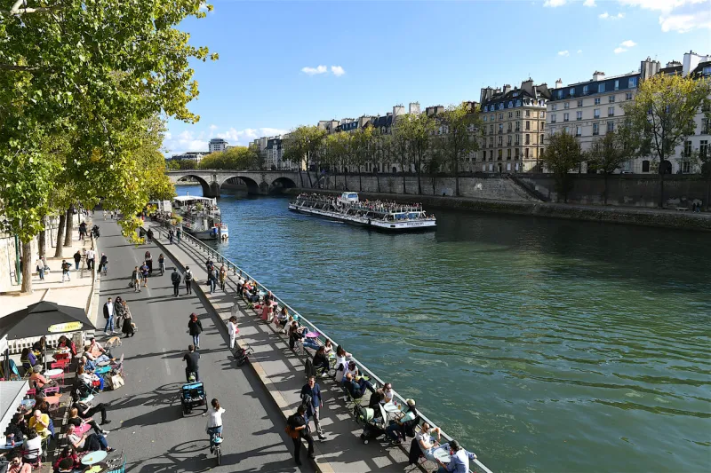 paris, france-10 08 2022  people enjoying the banks of the seine river, paris, france