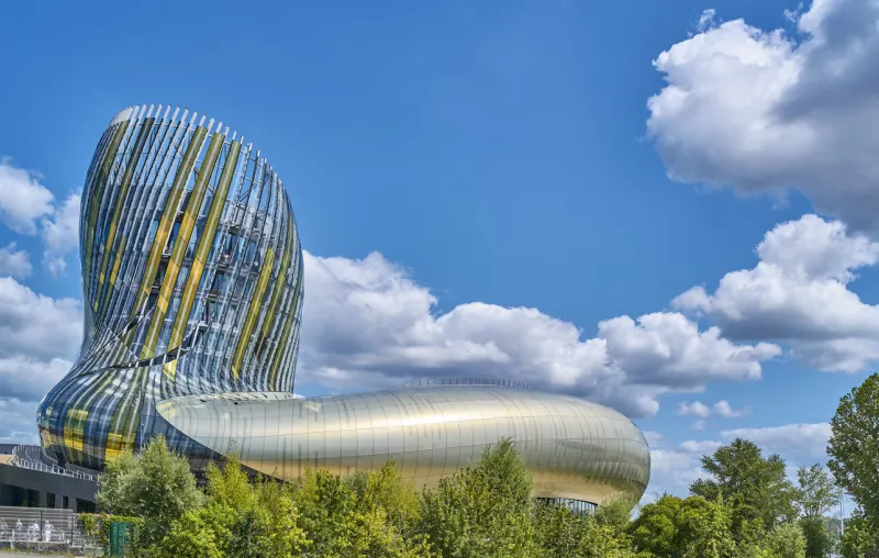 bordeaux, france - august 19, 2019  exterior view of the futuristic architecture of the wine city (citè du vin) museum and cultural center